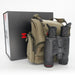 Black binoculars with a tan tactical shoulder bag and a black presentation box, photographed on a clean white studio background.