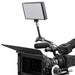 A Sony cinema camera with a mounted monitor, microphone, and matte box, shown against a solid white background.