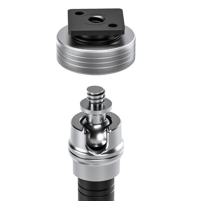 A close-up studio shot of a metal mounting accessory shown in an exploded view, with a black square top plate and a silver threaded cylindrical body separated vertically on a white background.