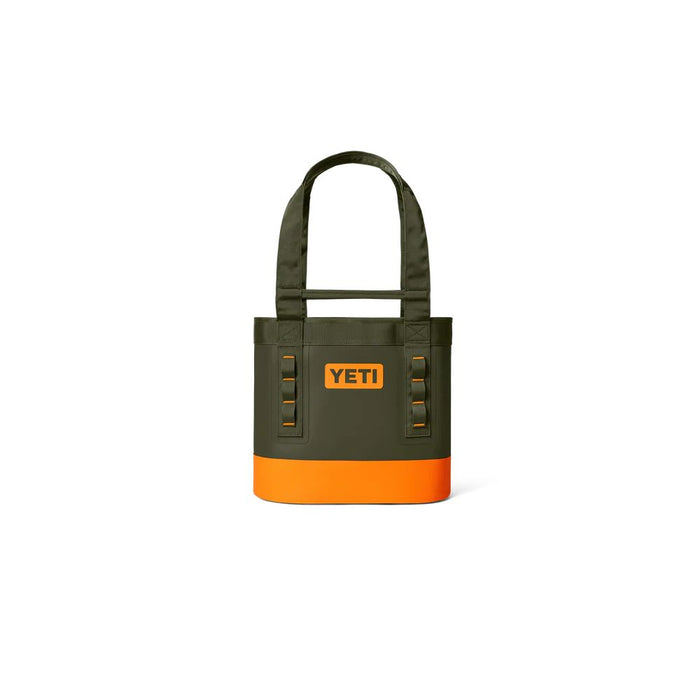 A YETI tote bag in olive green with a bright orange bottom panel and orange logo, shown on a plain white background.