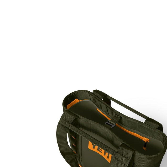 An olive green YETI tote bag with bright orange accents and a visible YETI logo, shown on a clean white background.