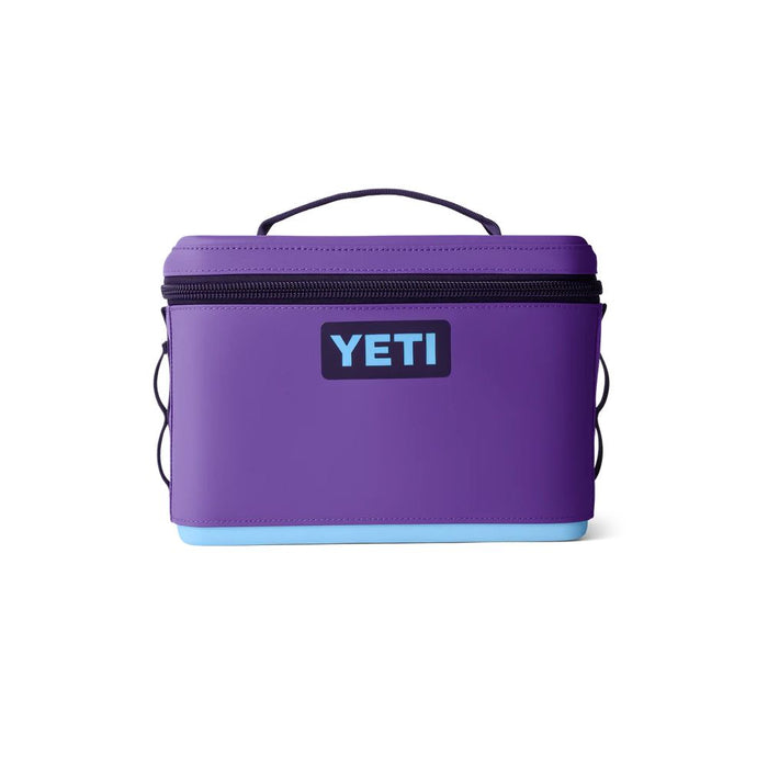 A purple YETI cooler bag with a black zipper, black handle, and a light blue bottom base, shown on a plain white background.