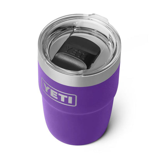 A purple YETI insulated travel tumbler with a clear lid and black straw, shown on a white background.