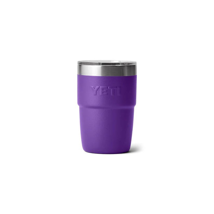 A purple YETI insulated travel tumbler with a stainless steel rim and a clear lid, shown on a plain white background.