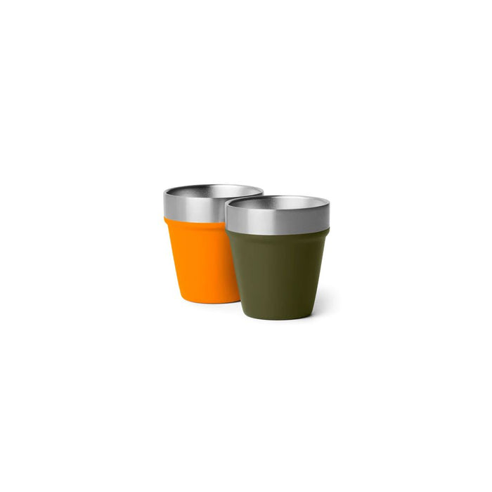 Two reusable tapered cups with metallic silver rims, one in bright orange and one in olive green, shown on a plain white background.