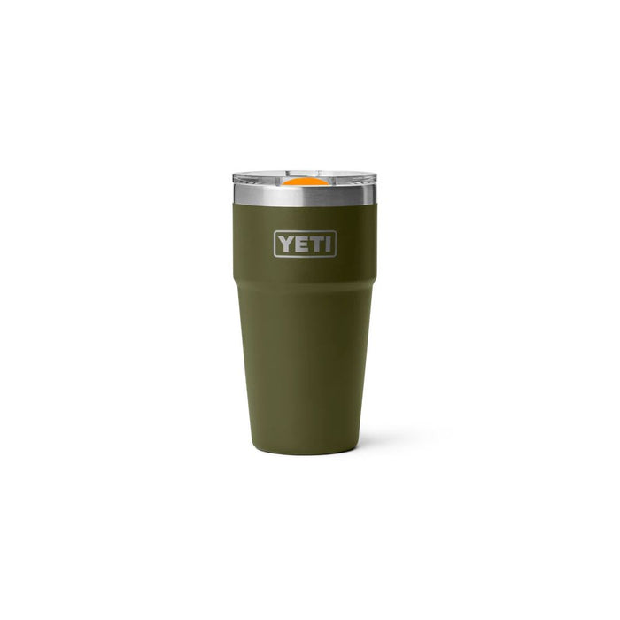 An olive green YETI insulated tumbler with a stainless steel rim and a clear lid featuring an orange accent, shown on a plain white background.